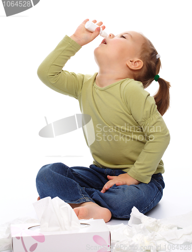 Image of Little girl spraying her nose