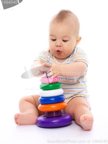 Image of Little boy play with toys
