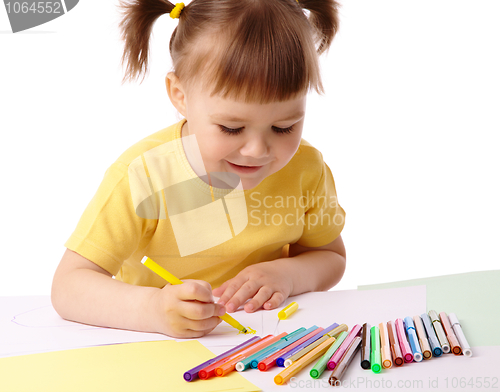 Image of Cute child draws with felt-tip pens