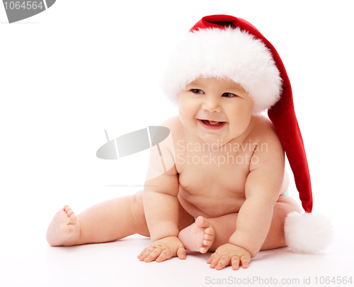Image of Little child wearing red Christmas cap