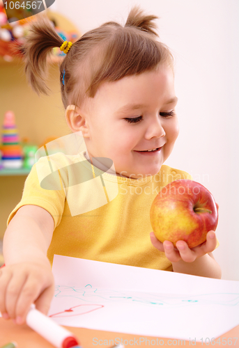 Image of Little girl with apple