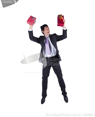 Image of Happy businessman with christmas presents