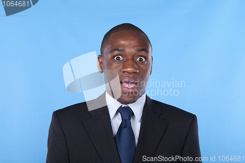 Image of Surprised african businessman