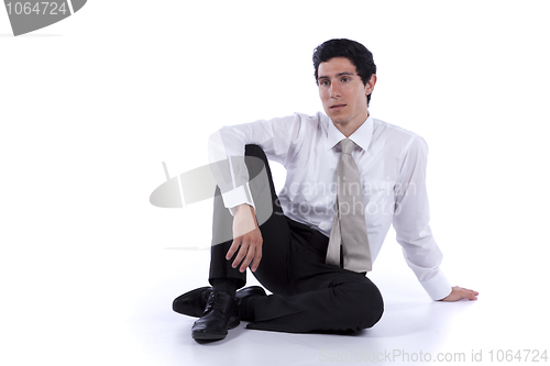 Image of Businessman sitting on the floor