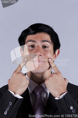 Image of Young businessman with a funny face