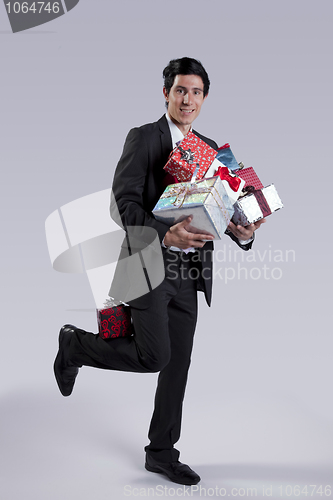 Image of Businessman with many gift packages