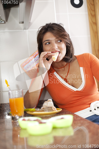 Image of Woman eating her breakfast