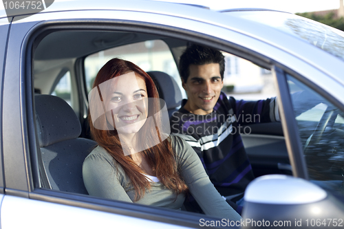 Image of Young couple inside the car