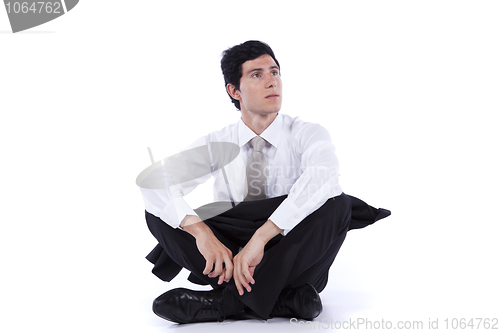 Image of Businessman sitting on the floor