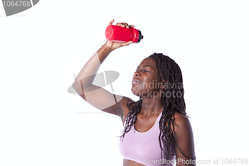 Image of Athlete woman drinking water