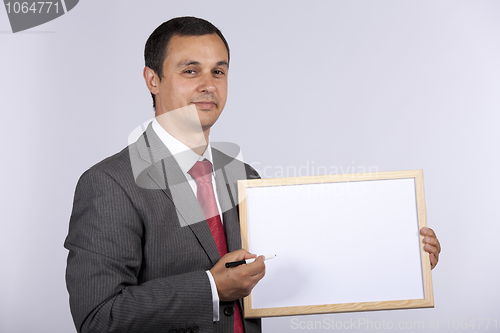 Image of businessman holding a whiteboard