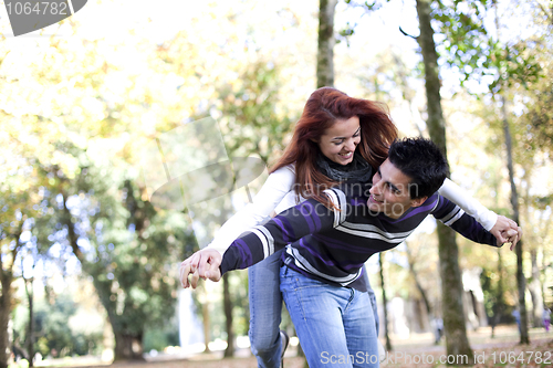 Image of Young couple having fun at the park