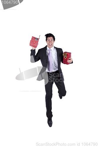 Image of Happy businessman with christmas presents