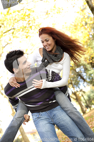 Image of Young couple having fun at the park