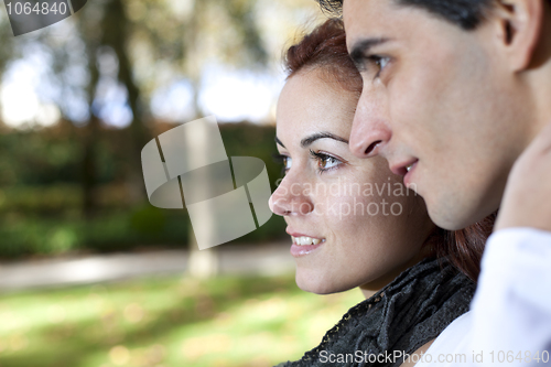 Image of young couple looking away