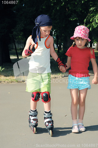 Image of Friendly support. Rollerblading.