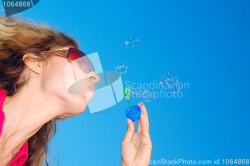 Image of blowing soap bubbles wand