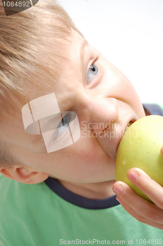 Image of boy biting an apple