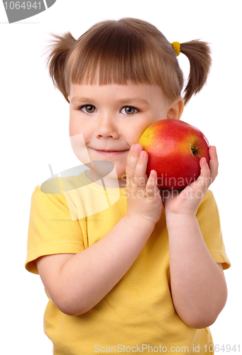 Image of Cute child with red apple
