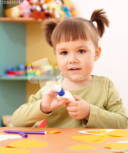 Image of Little girl doing arts and crafts in preschool