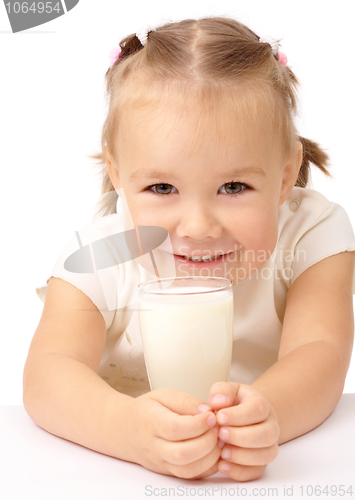 Image of Little girl with a glass of milk
