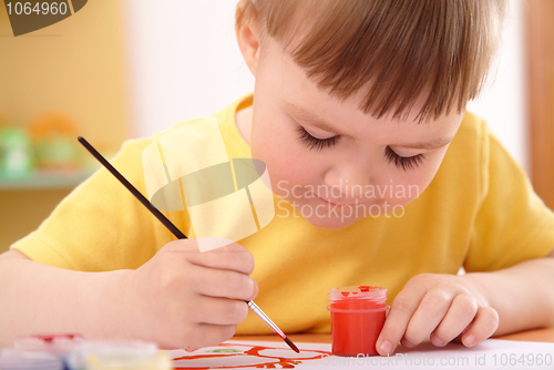 Image of Child draws with paints in preschool