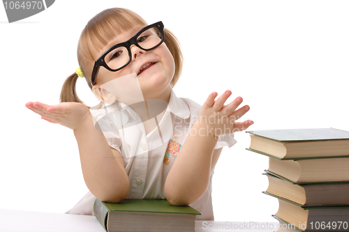 Image of Cute little girl with book, back to school