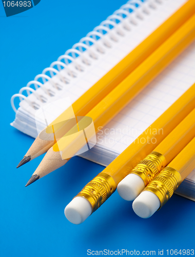 Image of Notepad and few pencils