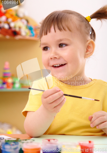 Image of Child draws with paints in preschool