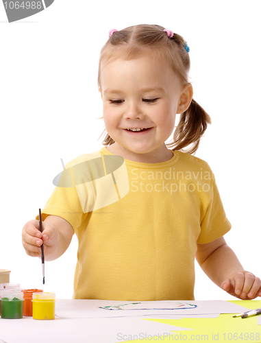 Image of Cute child play with paints