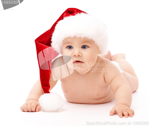 Image of Little child wearing red Christmas cap