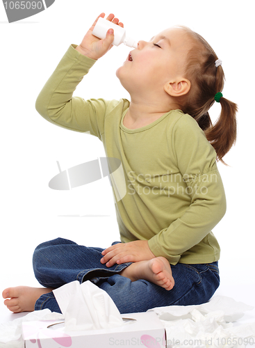 Image of Little girl spraying her nose