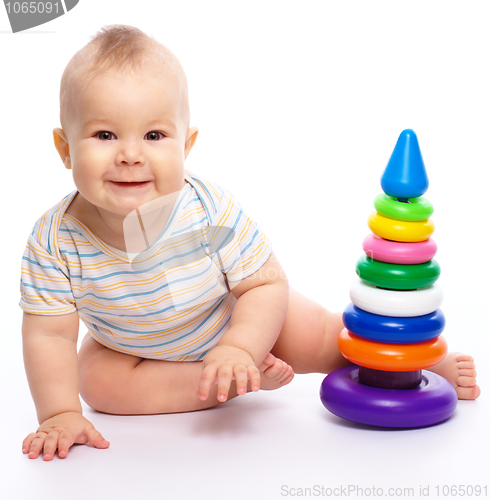Image of Little boy play with toys