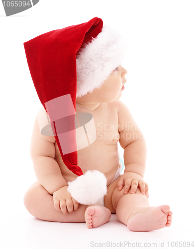 Image of Little child wearing red Christmas cap