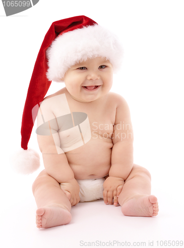 Image of Little child wearing red Christmas cap