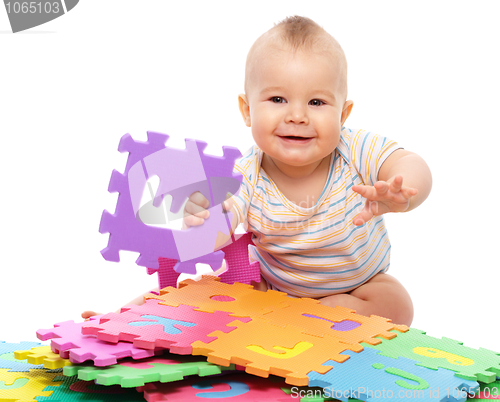 Image of Little boy plays with alphabet