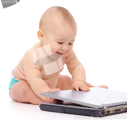 Image of Little baby with laptop