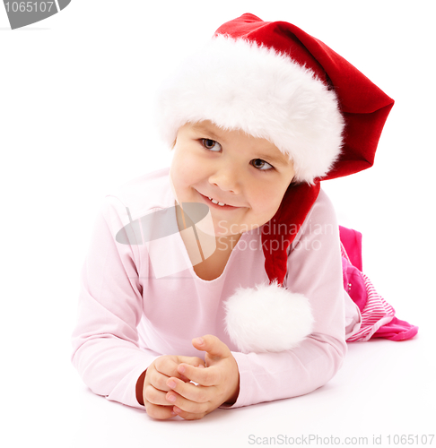 Image of Little girl wearing red Christmas cap
