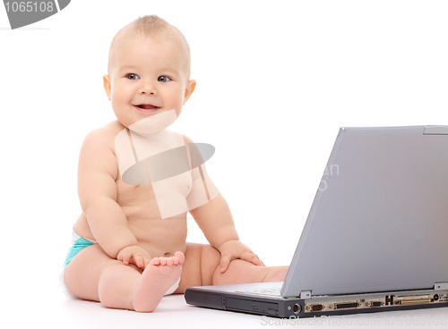 Image of Little baby with laptop