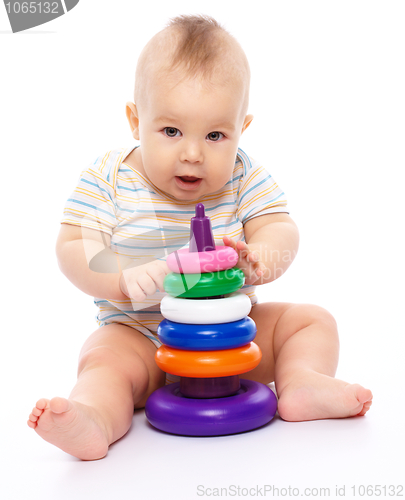 Image of Little boy play with toys