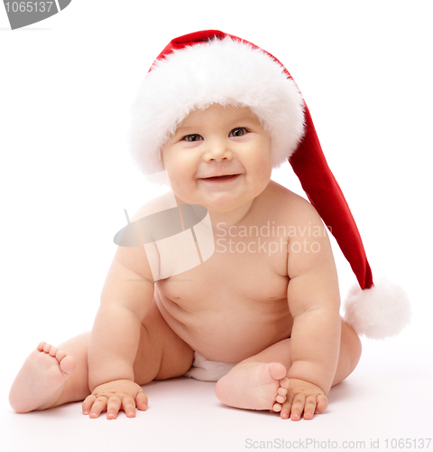 Image of Little child wearing red Christmas cap