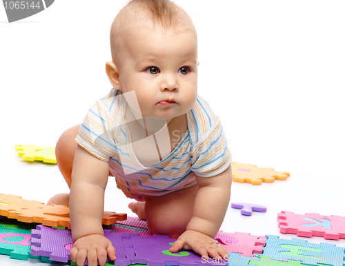 Image of Little boy plays with alphabet