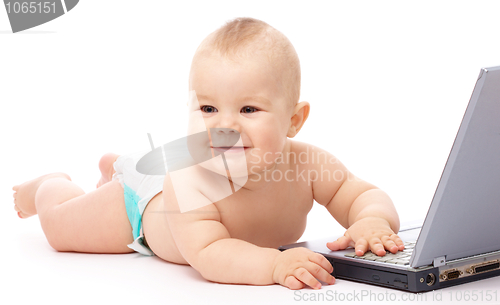 Image of Little baby with laptop