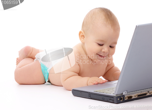 Image of Little baby with laptop