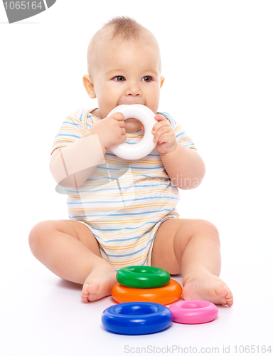 Image of Little boy with toys