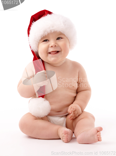 Image of Little child wearing red Christmas cap