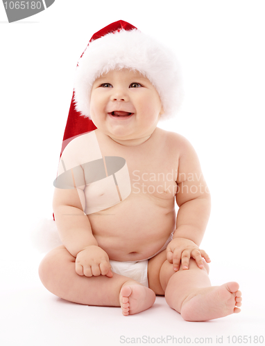 Image of Little child wearing red Christmas cap