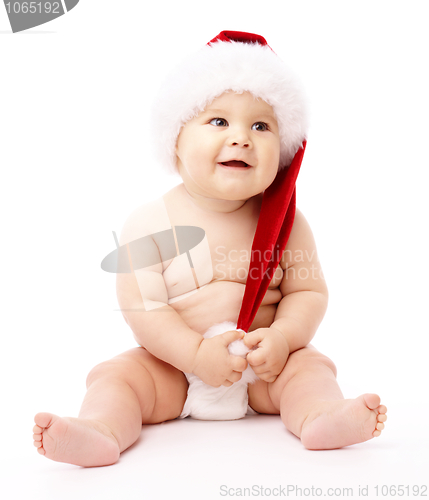 Image of Little child wearing red Christmas cap