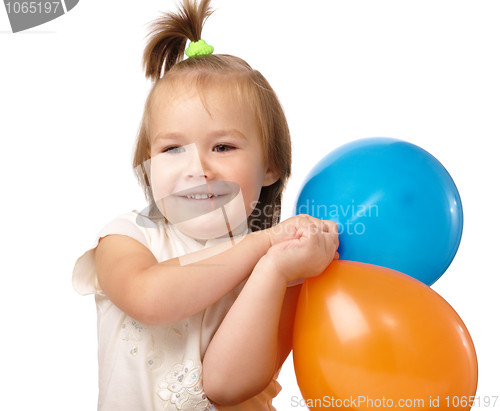 Image of Cute little girl with two colored balloons