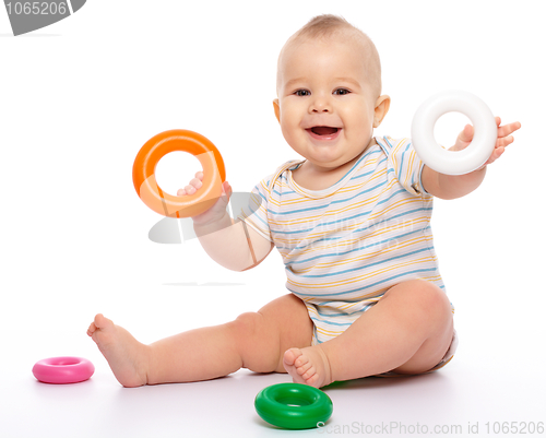 Image of Little boy play with toys